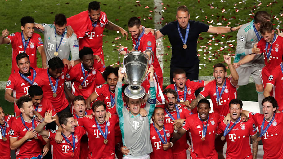 Manuel Neuer lifts Champions League trophy for Bayern Munich.