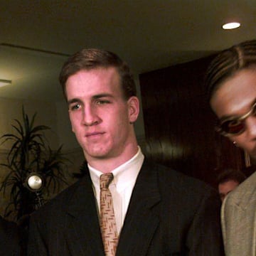 Charles Woodson and Peyton Manning pose with the Heisman Trophy at the Downtown Athletic Club Saturday night before the actual award was made. 1997. 

Peyton Manning At Heisman 1997