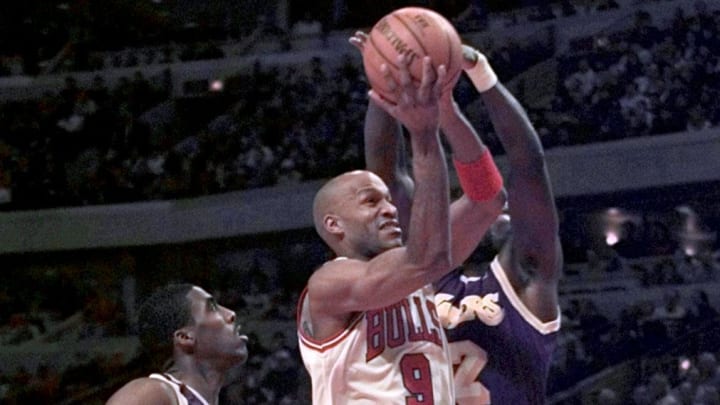 December 17, 1996; Chicago, IL; Chicago's Ron Harper(9), middle, goes for the basket in the first half. At left is LA' s Kobe Bryant(8) and at right is LA's Jerome Kersey (12). Mandatory Credit: Annie Ryan/USA TODAY-USA TODAY NETWORK 