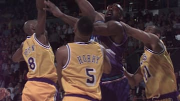 May 8, 1997; Inglewood, CA; Utah's Antoine Carr puts up a shot between the Lakers' Kobe Bryant, Robert Horry and Elden Campbell during game 3 of the NBA Western Conference Semifinals. Mandatory Credit: Robert Hanashiro-USA TODAY NETWORK 
