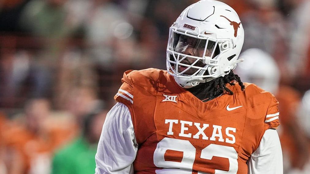 Texas Longhorns defensive lineman T'Vondre Sweat celebrates after a play during a college football game.