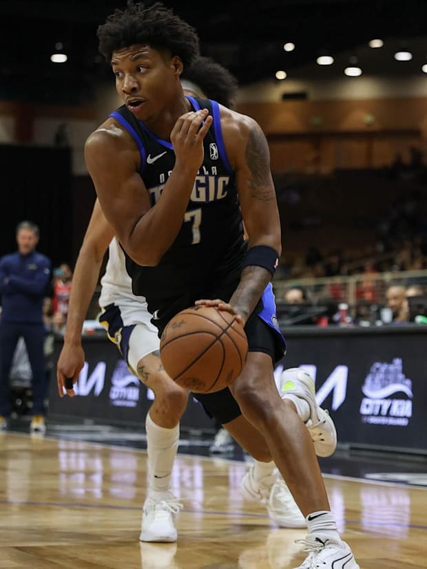 Osceola Magic forward Myron Gardner dribbles toward the basket in an NBA G League game.