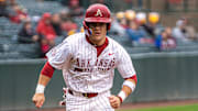 Cam Kozeal runs the bases in the series opener against Mizzou. The Razorbacks won 21-3