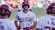 Brent Iredale with Cam Kozeal and Kuhio Aloy after hitting his seventh home run of the year against the Central Arkansas Bears. The Razorbacks won 9-2.