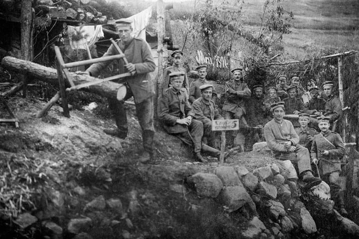 German soldiers pose in a trench during WWI