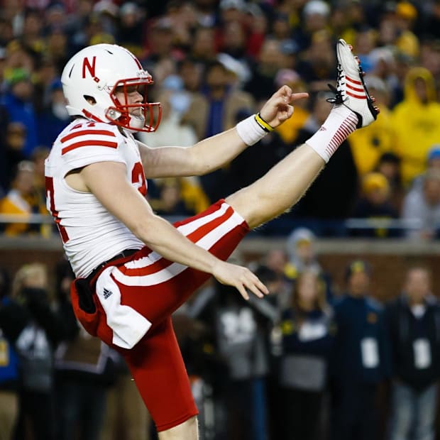 Sam Foltz punts during the Huskers' 2013 win at Michigan.