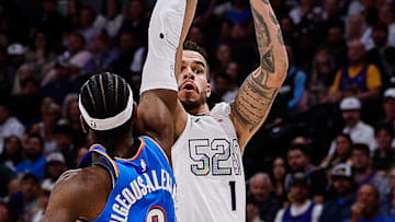 May 15, 2025; Denver, Colorado, USA; Denver Nuggets forward Michael Porter Jr. (1) attempts a shot as Oklahoma City Thunder guard Shai Gilgeous-Alexander (2) defends in the third quarter during game six of the second round for the 2025 NBA Playoffs at Ball Arena. Mandatory Credit: Isaiah J. Downing-Imagn Images