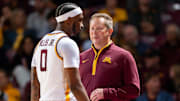 Niko Medved talking to Gophers guard Chansey Willis Jr. (No. 0) during the team's exhibition win over North Dakota State.