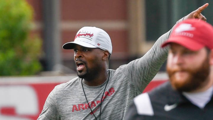 Arkansas Razorbacks defensive coordinator Travis Williams instructs unit during practice.