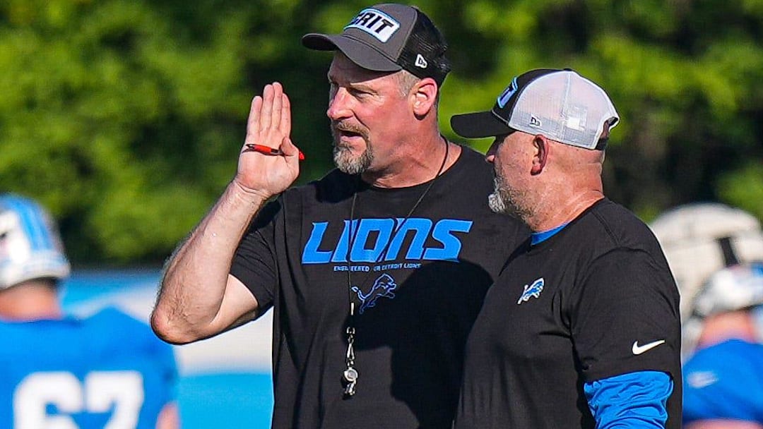 Detroit Lions head coach Dan Campbell talks to offensive coordinator John Morton during training camp at Meijer Performance Center in Allen Park on Monday, July 28, 2025.