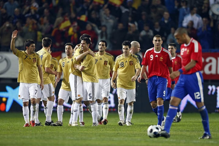 Spain's Joan Capdevila (C) is congratula
