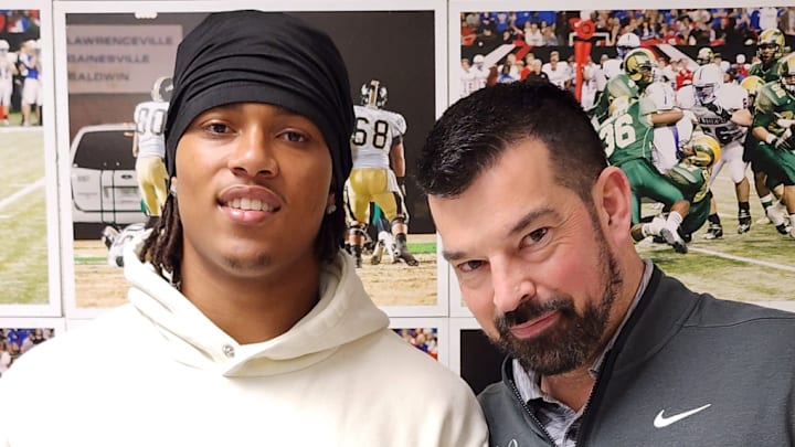 Grayson (Georgia) five-star linebacker Tyler Atkinson poses with Ohio State coach Ryan Day