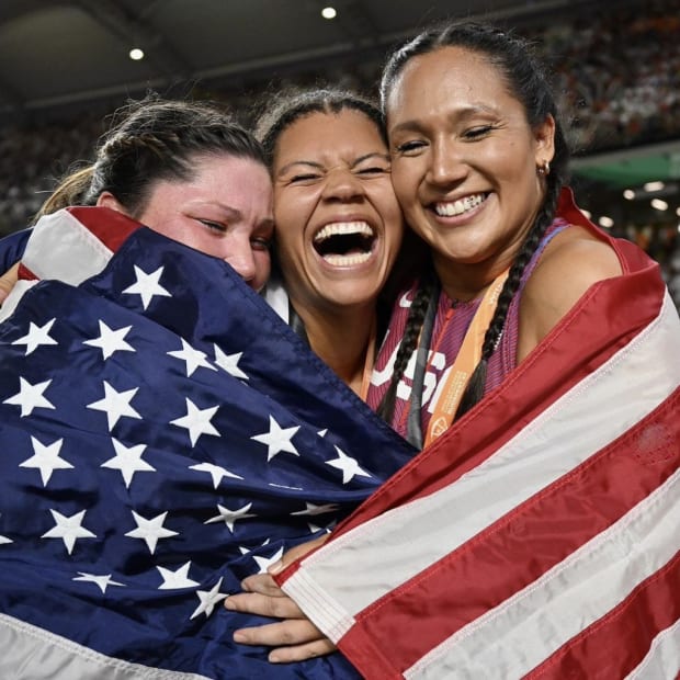 Camryn Rogers, center, celebrates with fellow 2023 World medalists DeAnna Price and Brooke Andersen