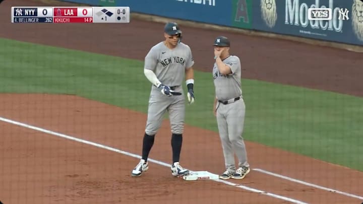 Aaron Judge stands on first base after being intentionally walked by the Angels in the first inning.