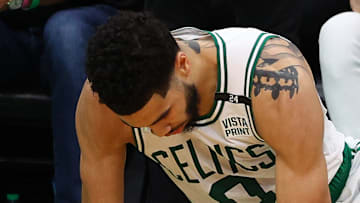 Boston Celtics star Jayson Tatum lifts himself from the hardwood in Boston's Game 4 NBA Finals loss to the Golden State Warriors.