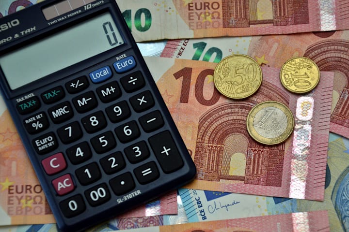In this photo illustration, a calculator seen on euro...