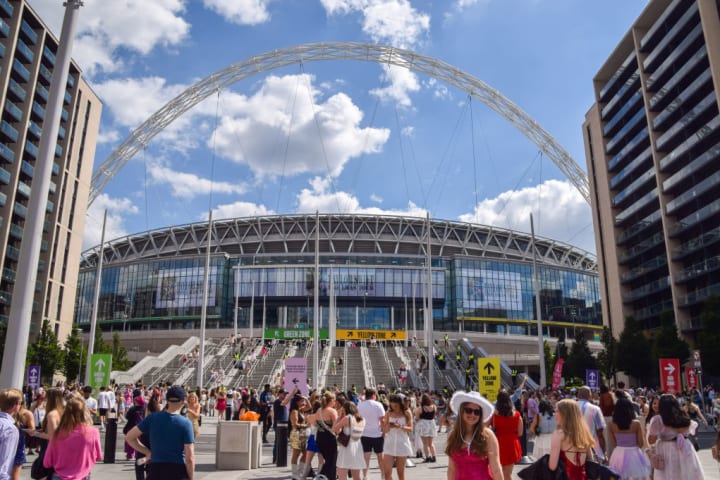 Taylor Swift fans, known as 'Swifties', arrive at Wembley...