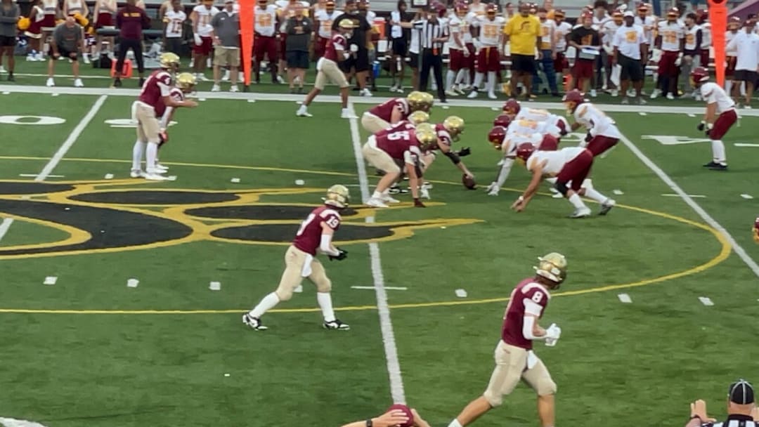 Drew Bellisari prepares to take a snap for Bishop Watterson against Westerville North on September 6, 2024. 