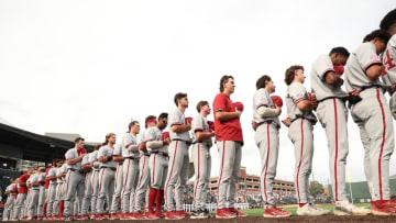 The Alabama baseball team during the national anthem prior to a game against Auburn.