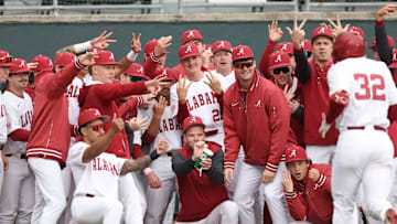 Alabama baseball players celebrate.