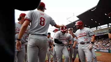 Alabama baseball players celebrate.