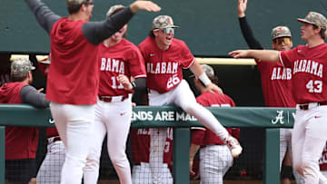 Alabama baseball players celebrating.
