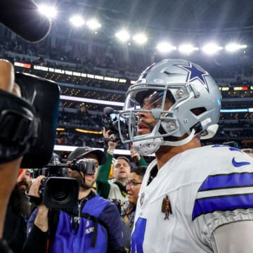 ARLINGTON, TX - JANUARY 14: Dallas Cowboys quarterback Dak Prescott (4) walks off the field after the NFC Wild Card game between the Dallas Cowboys and the Green Bay Packers on January 14, 2024 at AT&T Stadium in Arlington, Texas.