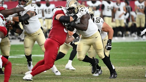 New Orleans Saints offensive linemen Olisaemeka Udoh (74) and Kyle Hergel (60) block against the Arizona Cardinals  