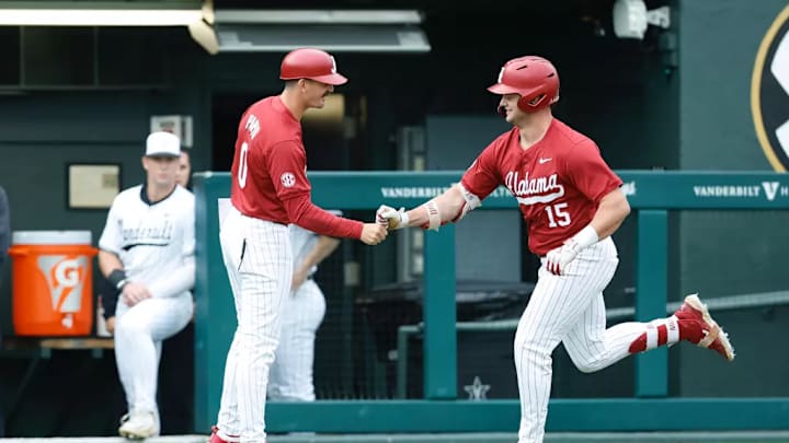 Alabama's Coleman Mizell (15) and assistant coach Anthony Papio (0). Alabama's Coleman Mizell (15) and assistant coach Anthony Papio (0).
