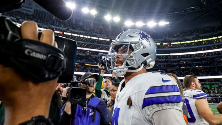 ARLINGTON, TX - JANUARY 14: Dallas Cowboys quarterback Dak Prescott (4) walks off the field after the NFC Wild Card game between the Dallas Cowboys and the Green Bay Packers on January 14, 2024 at AT&T Stadium in Arlington, Texas.