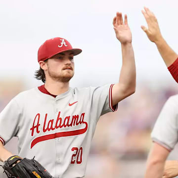 Zane Adams (20) high-fives Riley Quick.