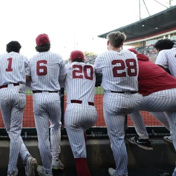 The Alabama baseball team in its dugout.