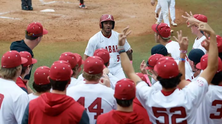 Alabama's Richie Bonomolo Jr. (5) celebrates with teammates against Georgia. Alabama's Richie Bonomolo Jr. (5) celebrates with teammates against Georgia.