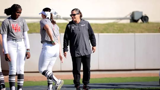 Former Houston softball coach Kristin Vesely (center)
