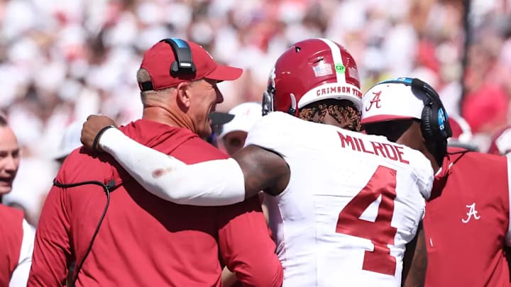 Alabama Football Head Coach Kalen DeBoer and Alabama Quarterback Jalen Milroe (4) smile against Wisconisin at Camp Randall Stadium in Madison, Wisconsin on Saturday, Sep 14, 2024.