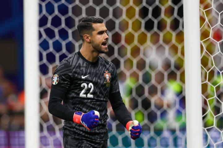 Diogo Costa of Portugal celebrates a saved penalty kick...