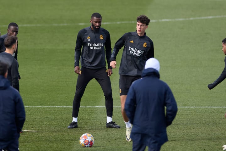 Antonio Rudiger of Real Madrid CF (L) competes for the ball...