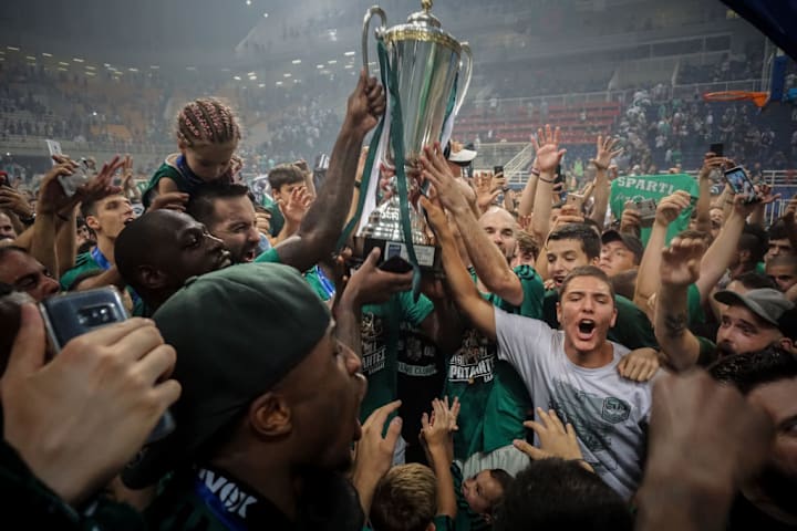 Panathinaikos superfoods team and supporters lifts the Greek...