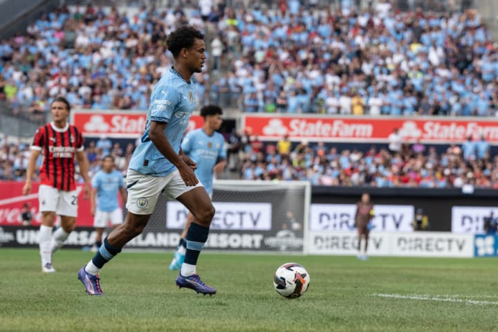 Oscar Bobb (52) of Manchester City controls the ball during...
