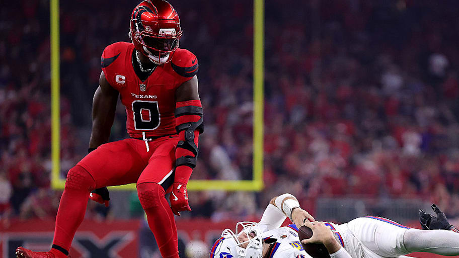 Buffalo Bills quarterback Josh Allen lays on the ground after being sacked by Azeez Al-Shaair.