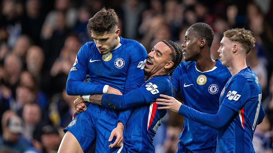 Pedro Neto is hoisted into the air by Malo Gusto