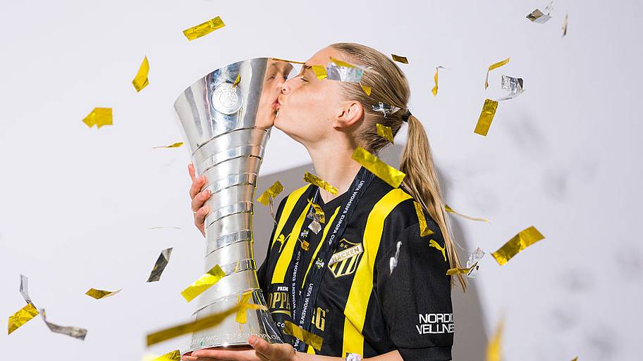 Stine Sandbech of BK Hacken FF kisses the UEFA Women's Europa Cup trophy.