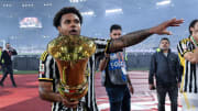 Weston McKennie celebrates with the Coppa Italia trophy