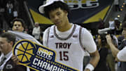New West Virginia Forward Jackson Fields celebrates SBC Title that he won with Troy this past year.