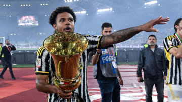 Weston McKennie celebrates with the Coppa Italia trophy