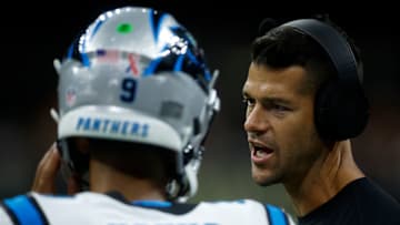 NEW ORLEANS, LOUISIANA - SEPTEMBER 08: Head coach of the Carolina Panthers Dave Canales talks with Bryce Young #9 of the Carolina Panthers against the New Orleans Saints at Caesars Superdome on September 08, 2024 in New Orleans, Louisiana.