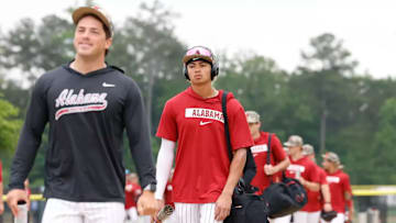 Alabama shortstop Justin Lebron arrives in Hoover with teammates.