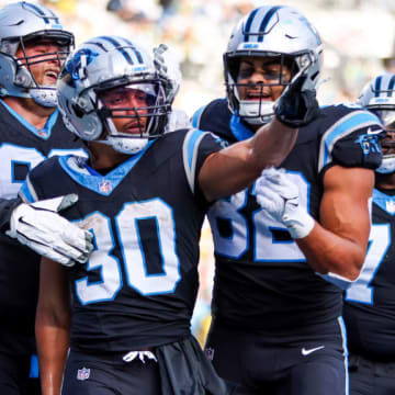 CHARLOTTE, NC - DECEMBER 24: Chuba Hubbard #30 of the Carolina Panthers celebrates a touchdown during an NFL game against the Green Bay Packers at Bank of America Stadium on December 24, 2023 in Charlotte, NC.