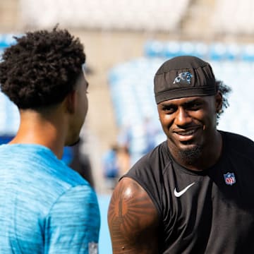 CHARLOTTE, NORTH CAROLINA - AUGUST 17: Xavier Legette #17 of the Carolina Panthers warms up with Bryce Young #9 of the Carolina Panthers before a preseason game against the New York Jets at Bank of America Stadium on August 17, 2024 in Charlotte, North Carolina.