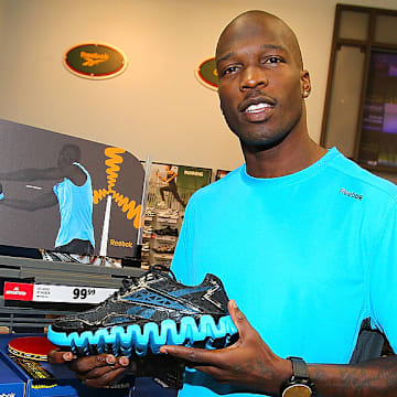 CARMEL, IN - MARCH 22: Chad Ochocinco surprises customers with Reebok ZigTech apparel at Dick's Sporting Goods on March 22, 2011 in Carmel, Indiana.